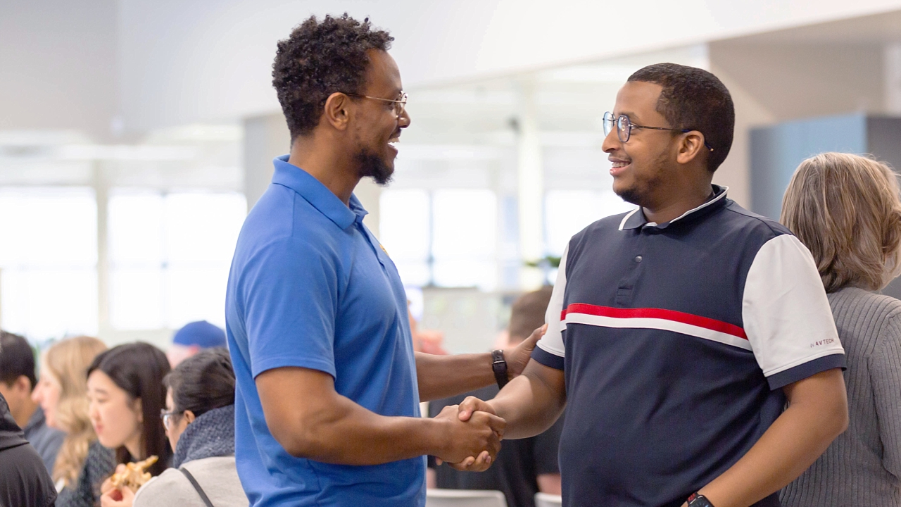 Young black males shaking hands